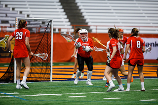 Cornell's Poullott carries the ball in her stick. 